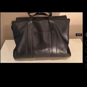Aritzia’s Six Eleven black leather McDuffle